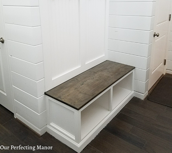 Mudroom bench with a gray stain.