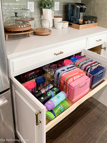 Organize your kitchen with a towel drawer under a stainless steel