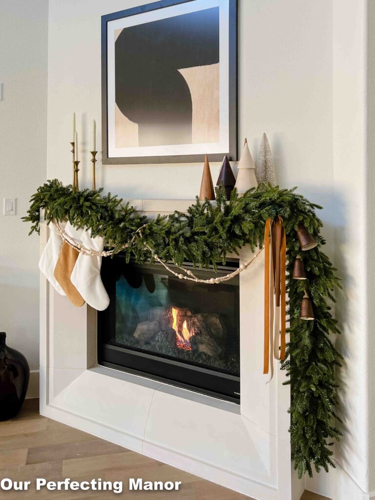 Decorated Christmas mantle with copper and neutral colors